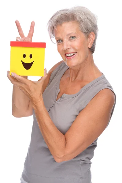 Senior woman with box — Stock Photo, Image