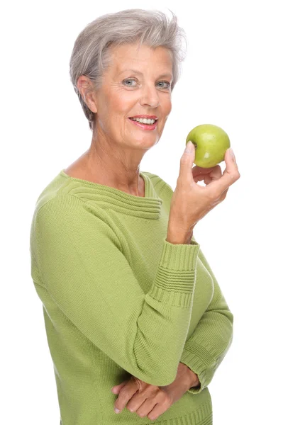 Äldre kvinna med äpple — Stockfoto