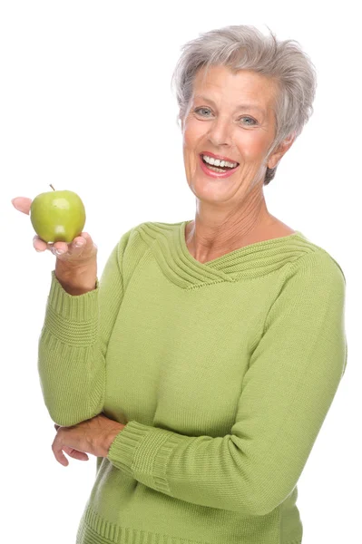 Старша жінка з яблуком — стокове фото