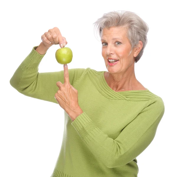 Mujer mayor con manzana —  Fotos de Stock