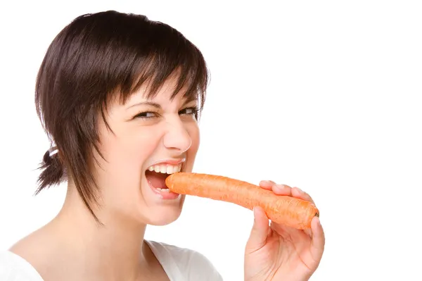 Woman with carrot — Stock Photo, Image