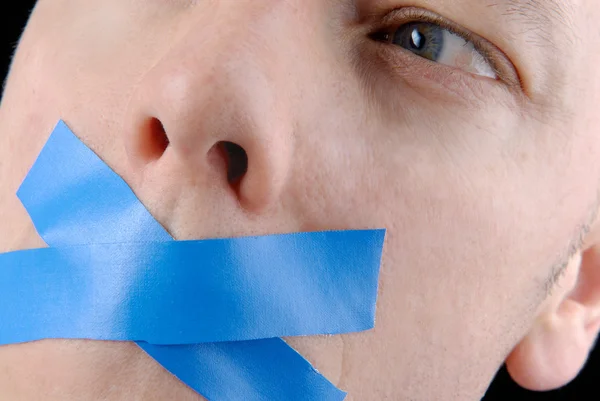 Young business man with adhesive tape. — Stock Photo, Image