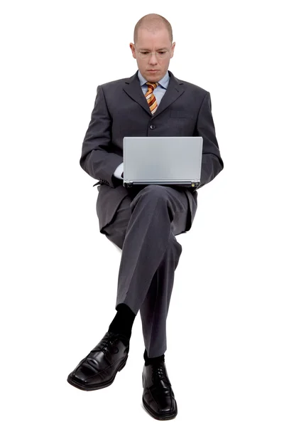 Сидящий бизнесмен — стоковое фото