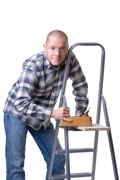 Junger Mann mit Holzhobel — Stockfoto