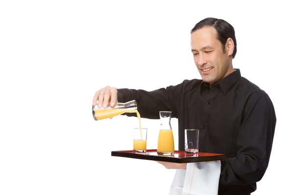 Cameriere versando succo — Foto Stock