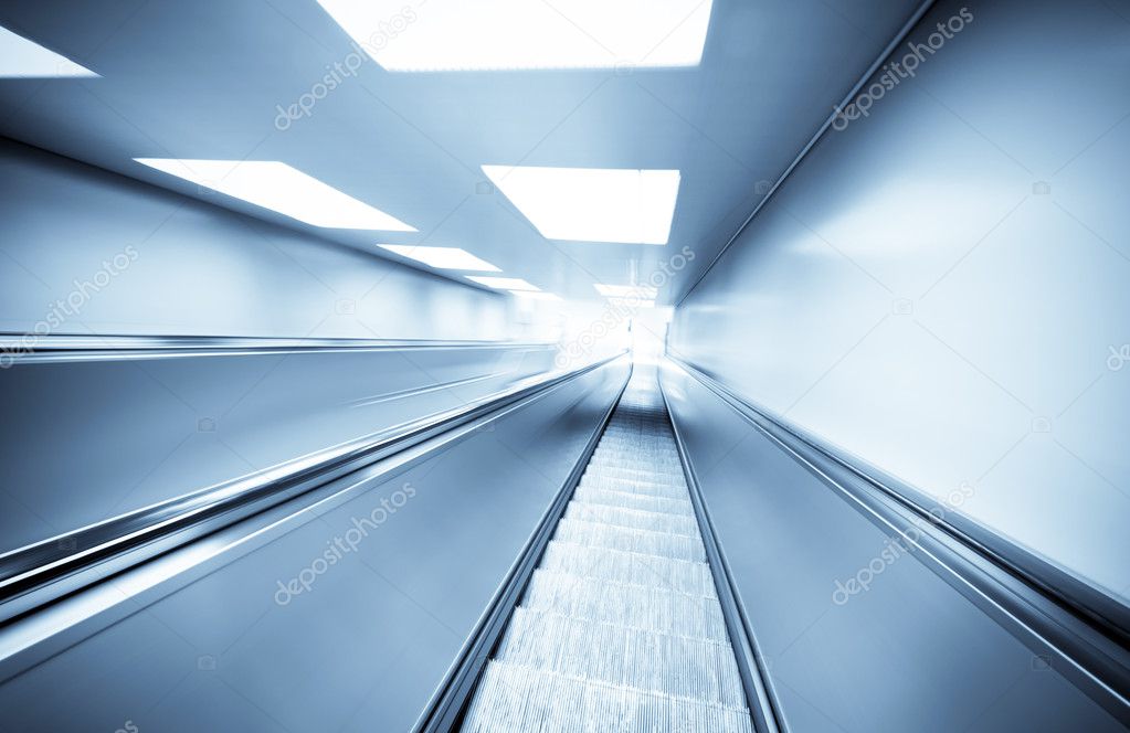 Abstract background of moving escalator in tunnel