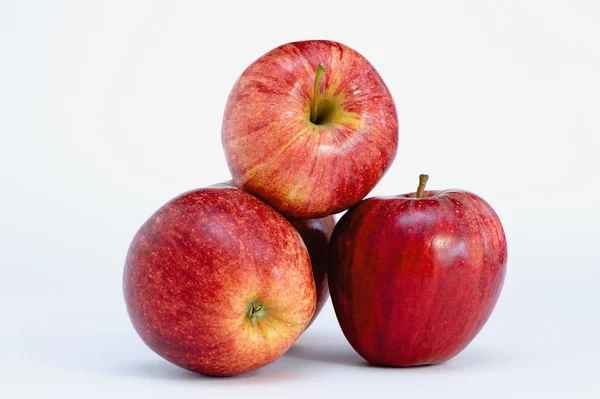 Four red apples