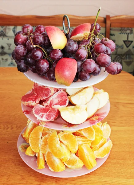 stock image Glass vase with a variety of fresh fruit