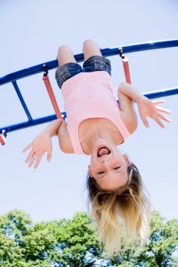 Girl playing in park clipart