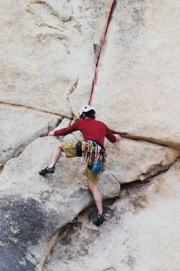 Man rock climbing clipart