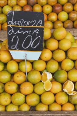 Oranges in a street market clipart