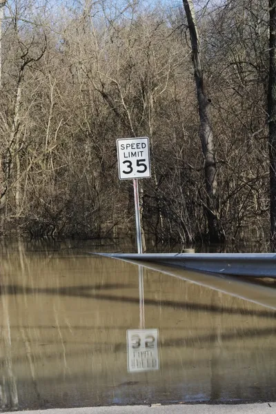 Road leading into flood waters — Stock Photo, Image