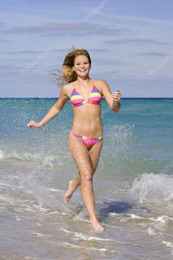 Teen in bikini on beach