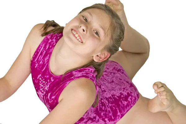 10 anno vecchio ragazza in ginnastica pose — Foto Stock