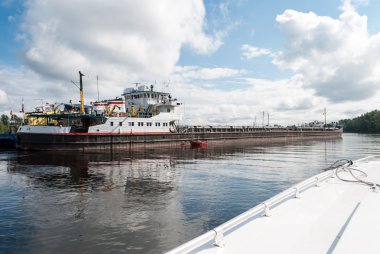 Not loaded barge on the river. clipart