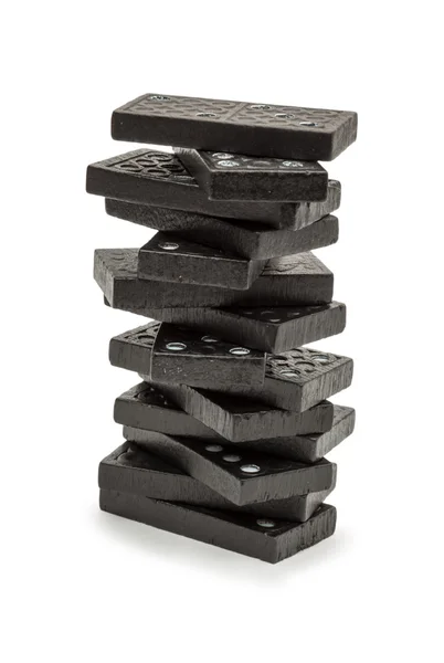 stock image Black dominoes stacked in a tower.