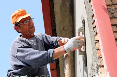 Mason Worker Plastering Wall clipart