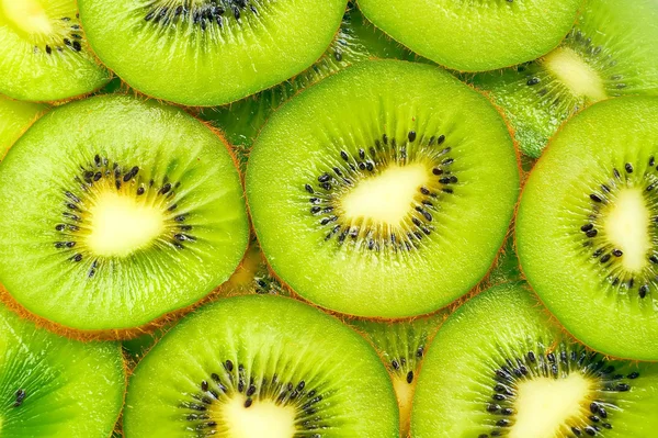 stock image Frash Kiwi slices for background green