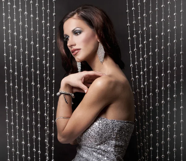 Brunette and silver dress — Stock Photo, Image