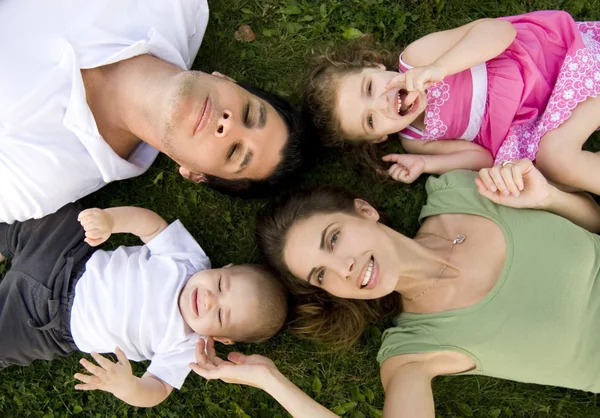 Family relaxing outdoors — Stock Photo, Image