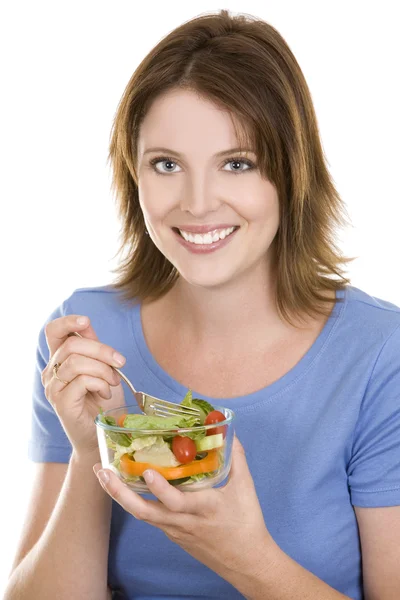 Příležitostné žena jíst salát — Stock fotografie