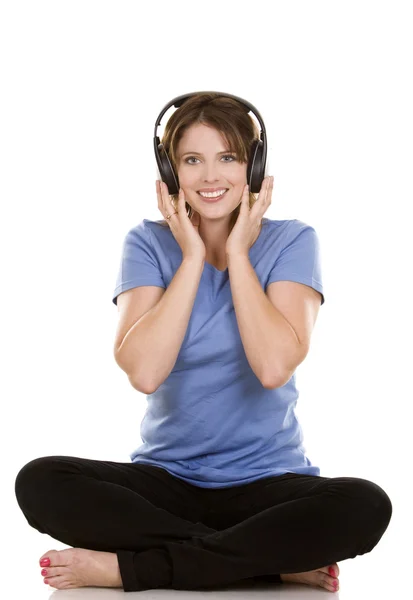Woman listening to music — Stock Photo, Image