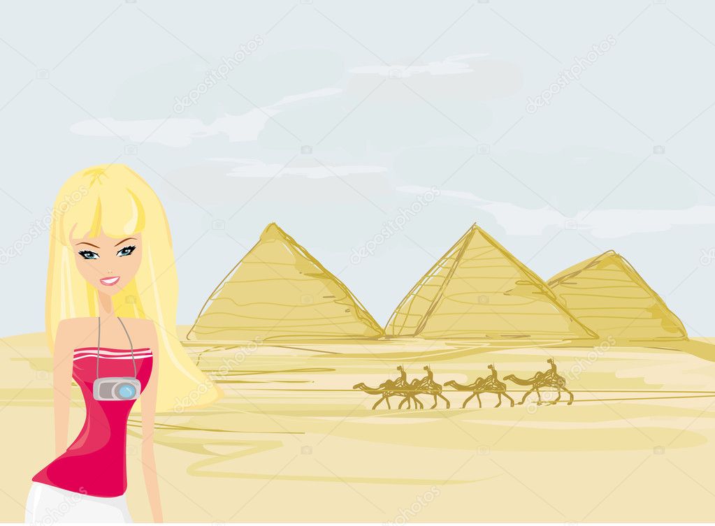 Women on background the pyramids in Giza built for the pharaoh