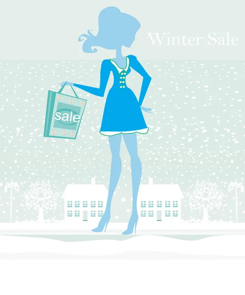 时尚冬季女孩与购物袋-冬季出售 — 图库照片