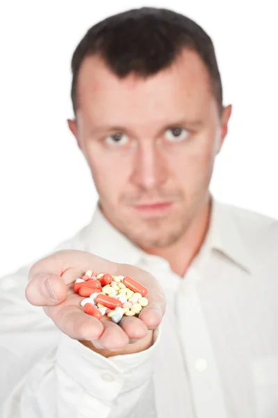 Närbild av tabletter i en hand — Stockfoto