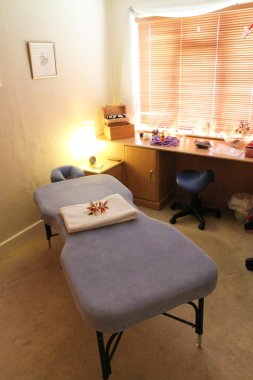 Massage table in a room clipart