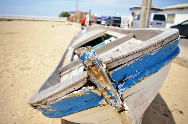 stock image Old blue boat on the beach