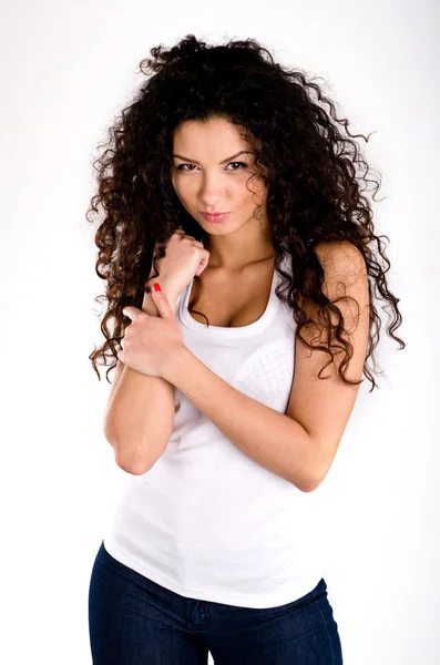 Curly haired girl look at camera arms are closed — Stock Photo, Image