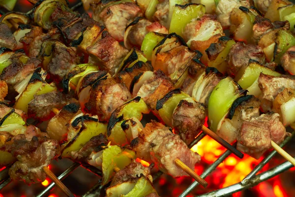 Roasting meat on a grill — Stock Photo, Image