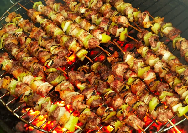 Roasting meat on a barbecue — Stock Photo, Image