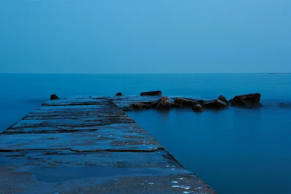 stock image Old quay in blue moonlight