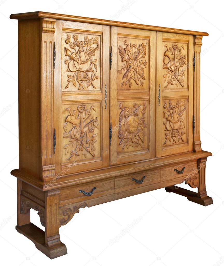 Old classic wooden dresser with handmade woodcarvings