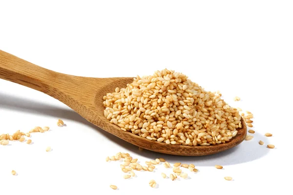 stock image Sesame grains in large wooden spoon