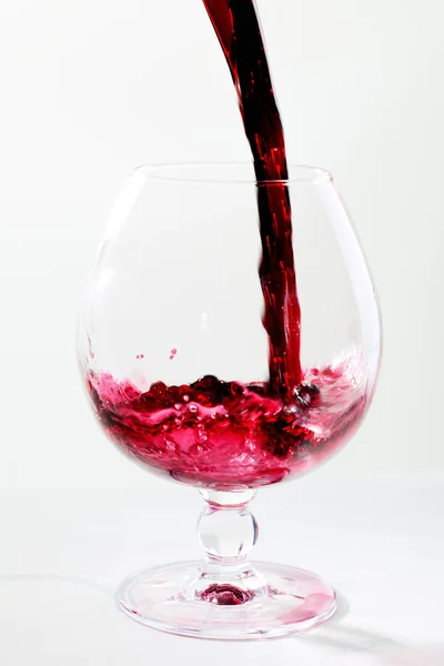 Filling a glass with red wine — Stock Photo, Image