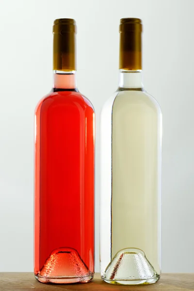 stock image Two bottles of red and white wine without labels