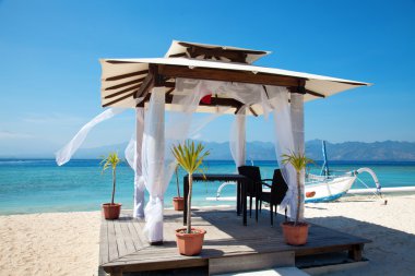 Beach weddings pavillion in Gili islands clipart