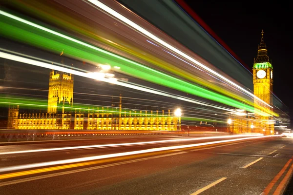 Big Ben London with lights from incoming bus — Stock Photo, Image