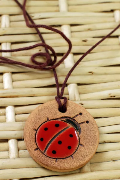 Clay amulet ladybug — Stock Photo, Image