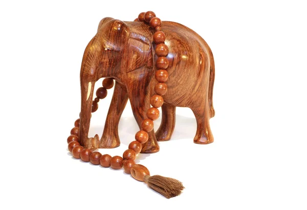 Een houten olifant en houten beeds — Stockfoto