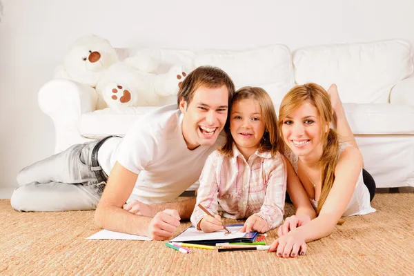 Familia feliz en casa divirtiéndose Imagen De Stock