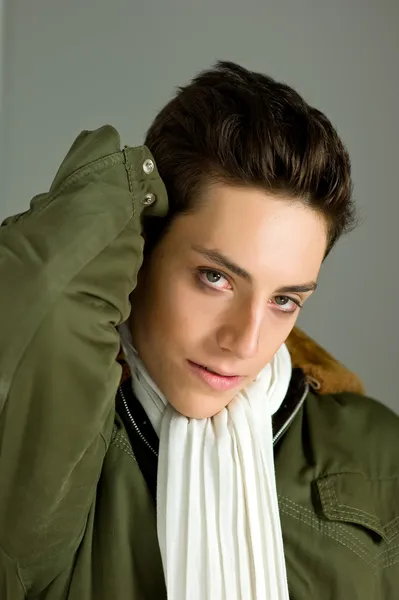 stock image Young boy with green jacket and white aviator scarf