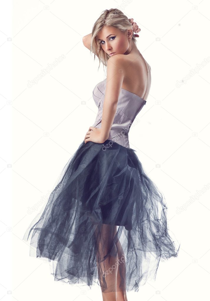 Young beauty woman on white background wearing gorgeous dress