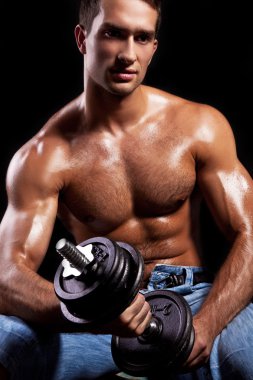 Fitness - powerful muscular man lifting weights clipart