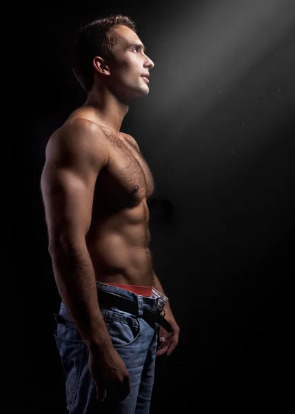 Art photo of a young muscular man — Stock Photo, Image