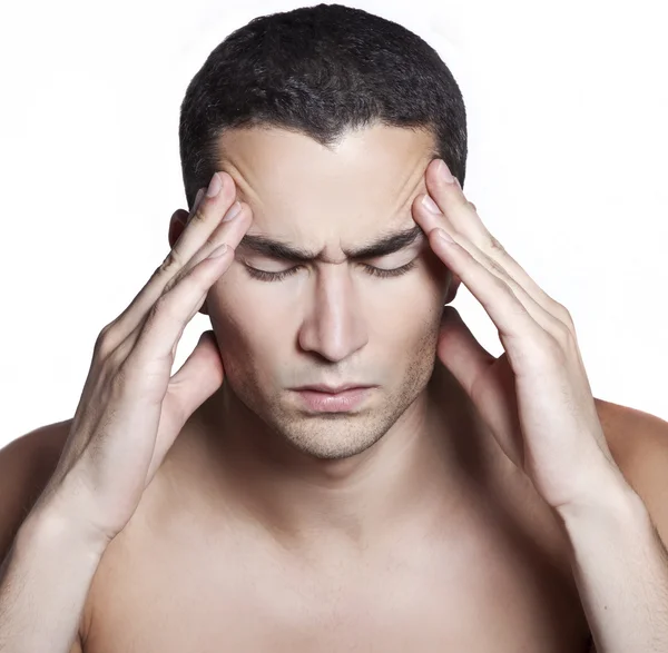 stock image Handsome man having a migraine isolated on white