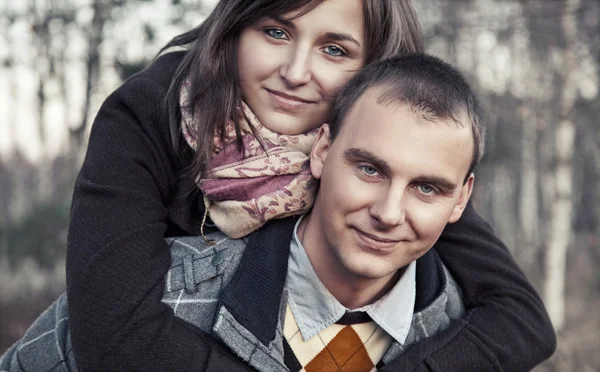 stock image Portrait of young couple in autumn scenery